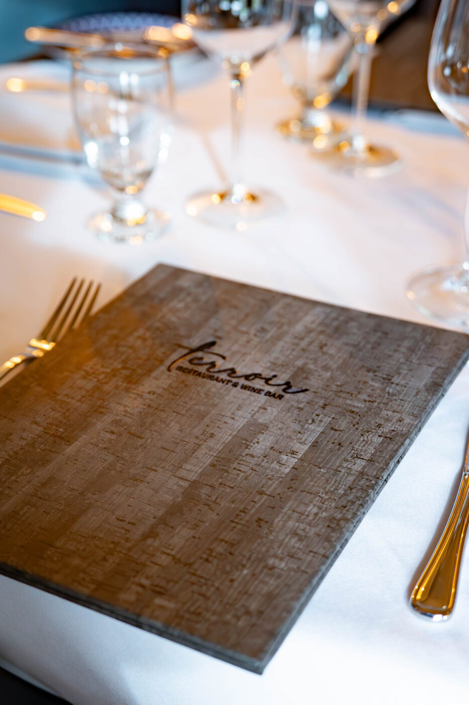 Terroir Menu on elegant dining table set for service